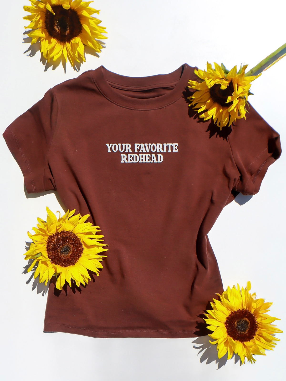 the 'your favorite redhead' baby tee